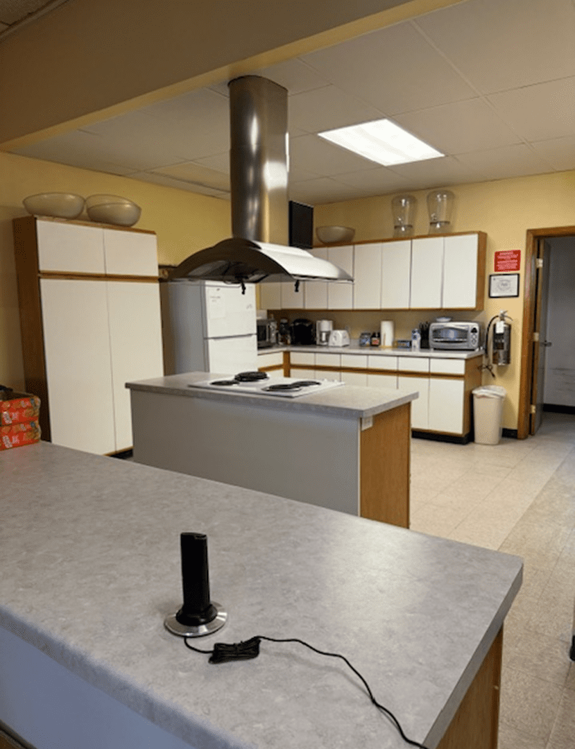 Spacious kitchen with white cabinets