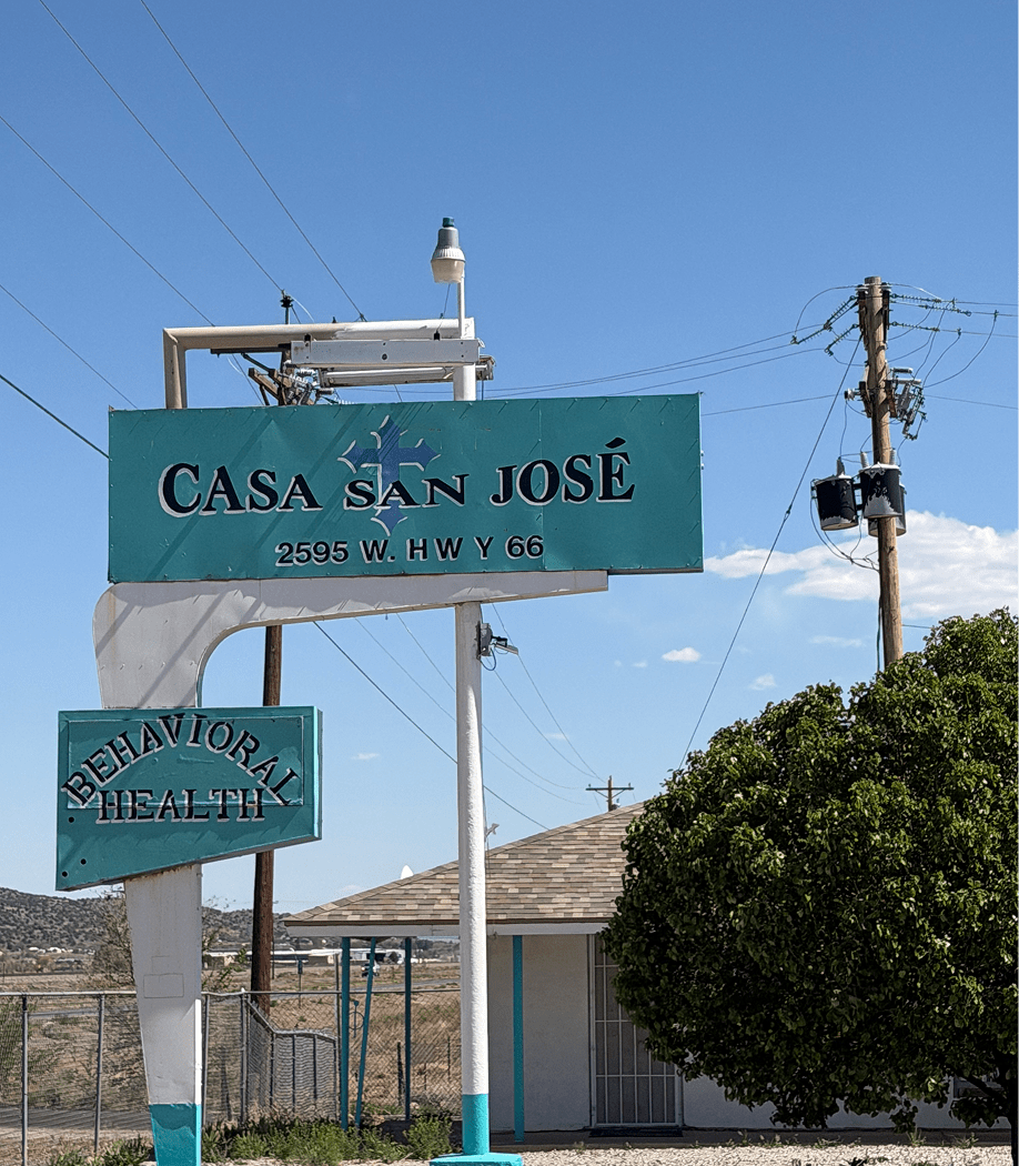 Blue sky behind health facility signs