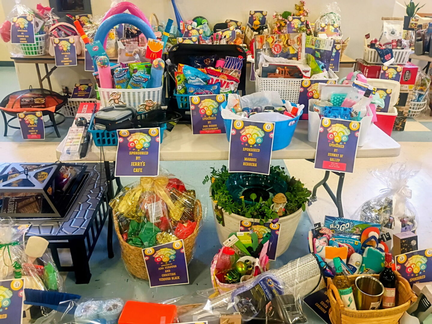 Assorted colorful gift baskets on display tables